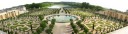 The panorama looking down on the lovely spirals of the Orangerie with 
the Swiss Lake in the background.  Excellent. For this shot, I 
was on regular ground (i.e., not within the palace).  I can look down 
because the Orangerie is lower than most of the rest of the estate. 

